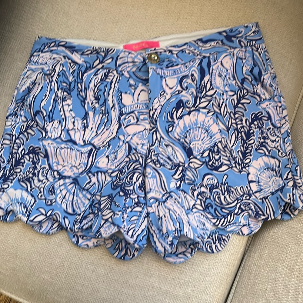 Cute coastal theme print 
Different blues , pale pink also